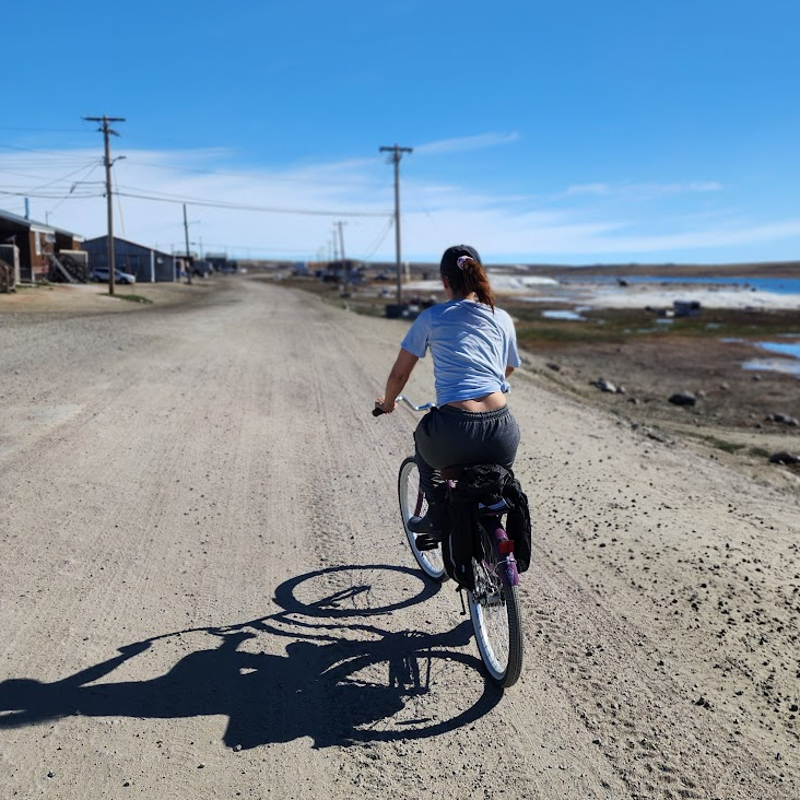 juliana biking in nunavut wearing a tshirt